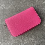 Wallet with circular zip closure