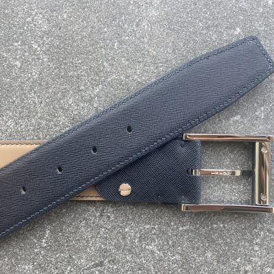 Dark navy Saffiano leather belt – close-up of buckle and tan leather lining