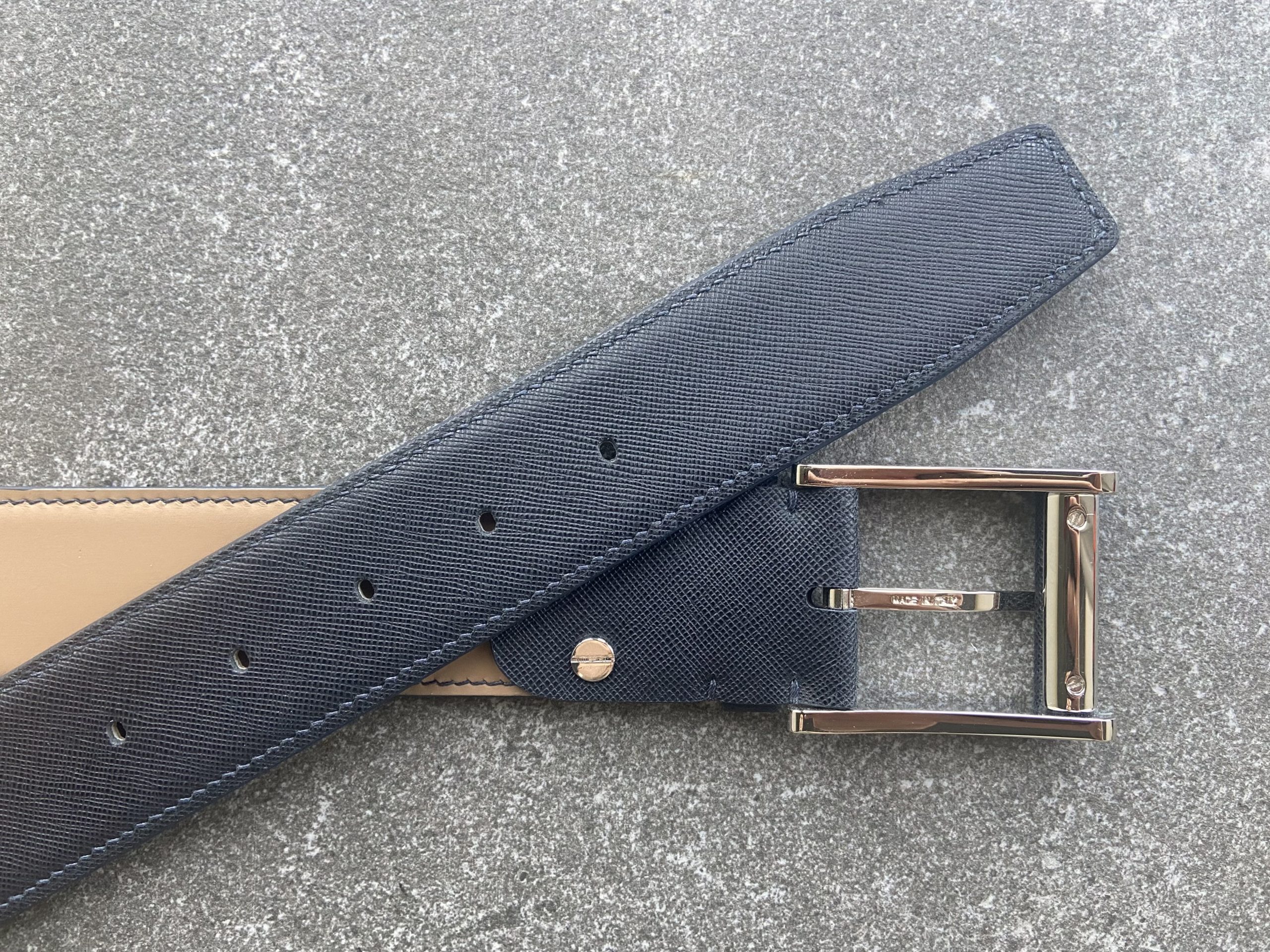 Dark navy Saffiano leather belt – close-up of buckle and tan leather lining