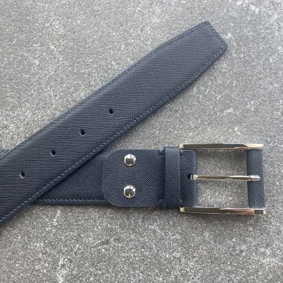 Dark navy Saffiano leather belt – angled view with buckle and tip visible
