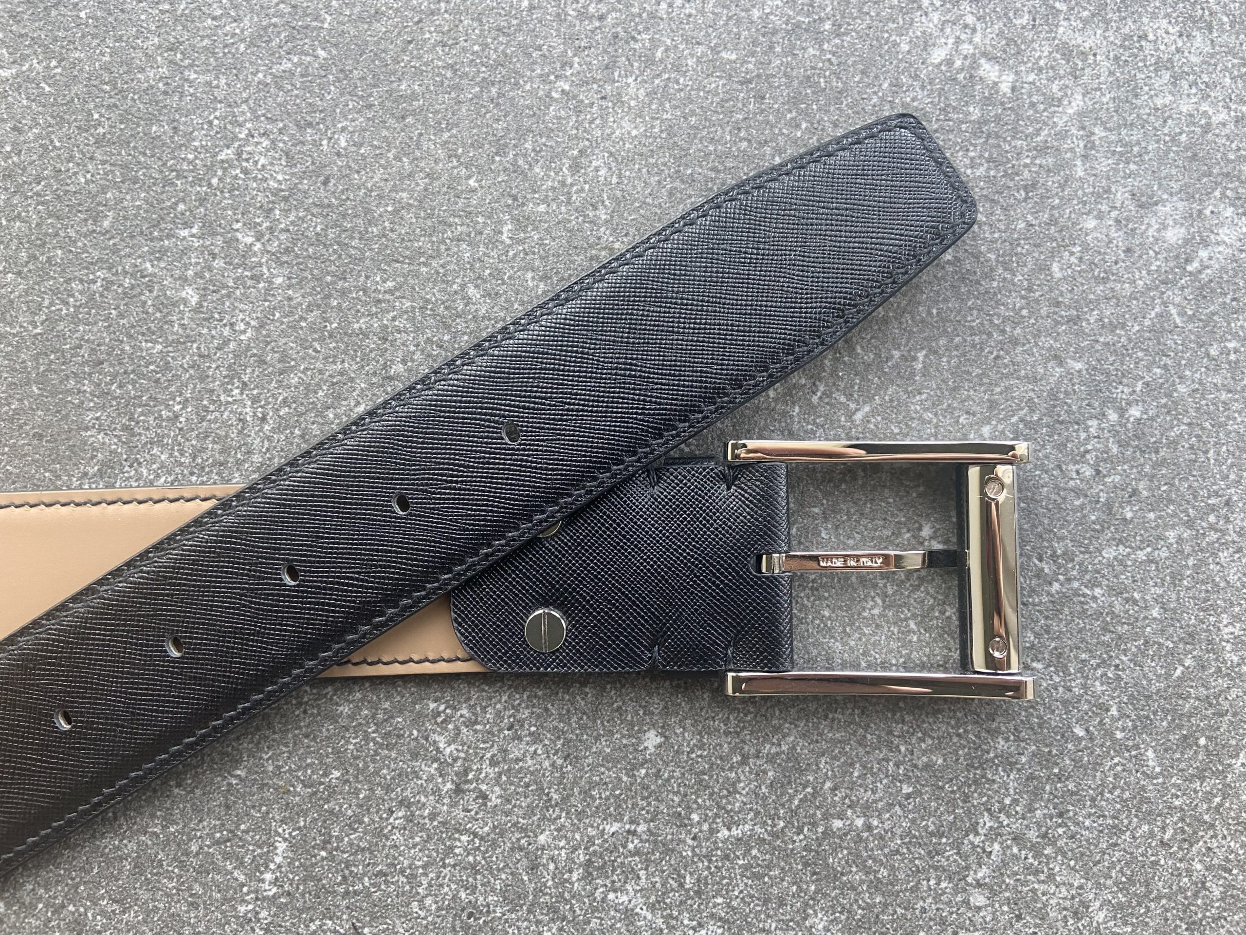 Handmade black Saffiano leather belt with beige water-repellent lining and solid brass buckle