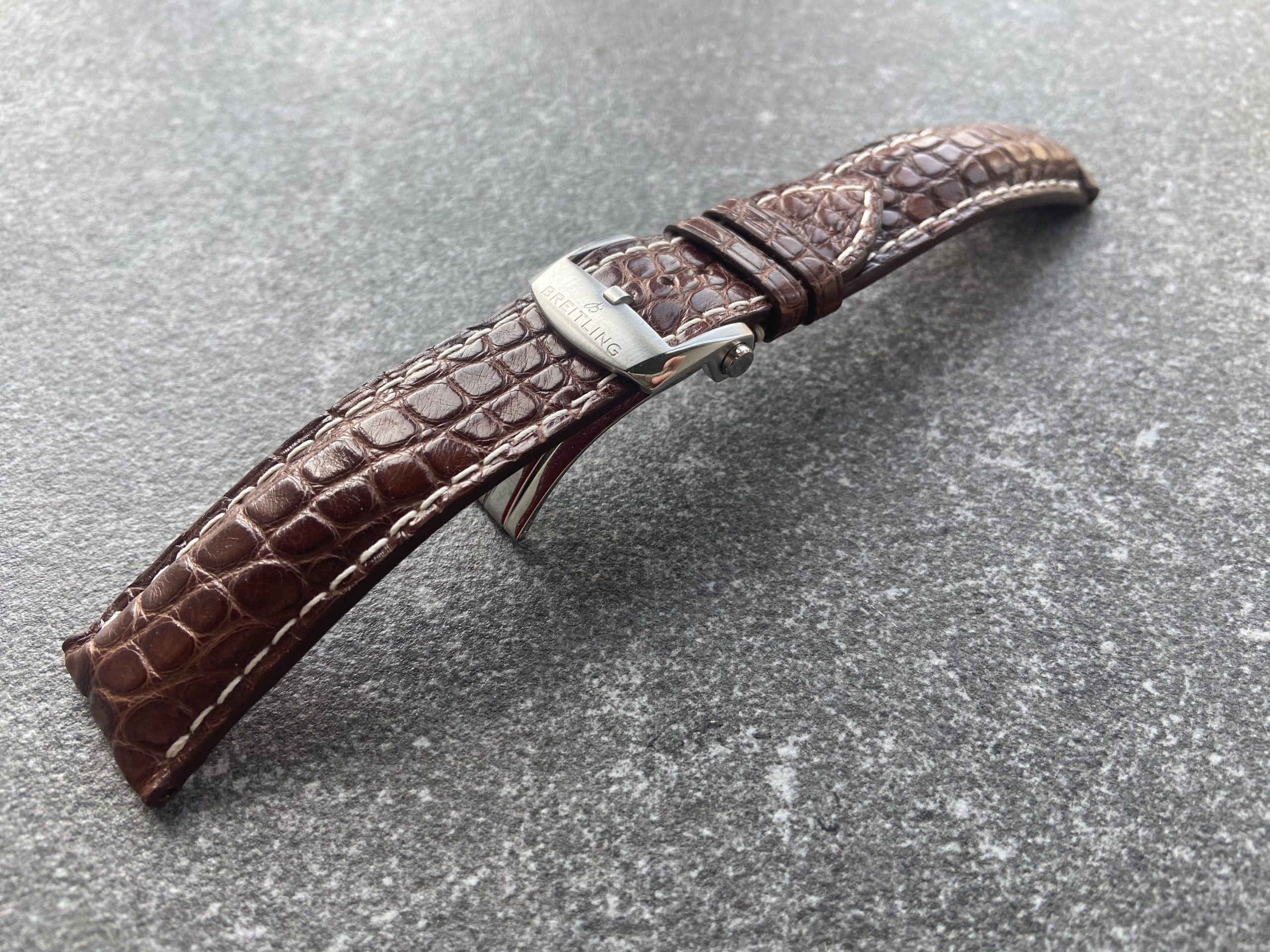 Cognac alligator leather watch strap with white stitching and original Breitling clasp