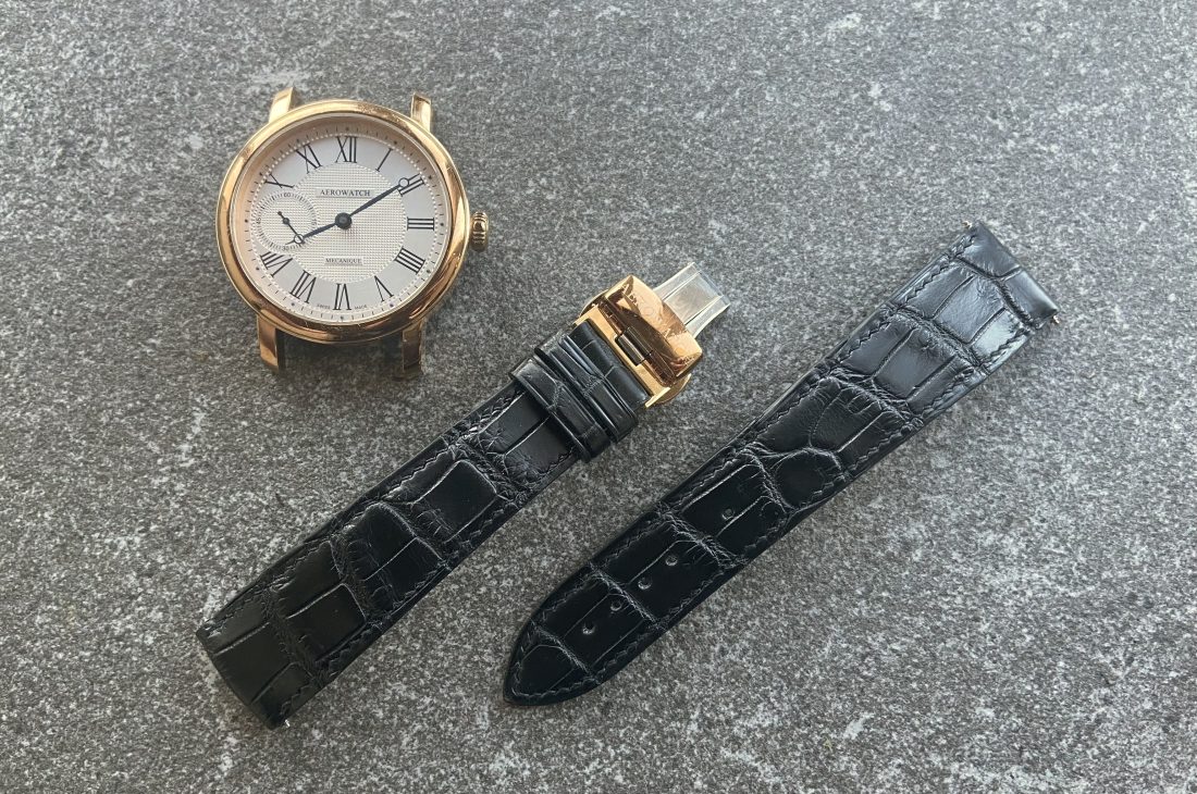 Black alligator leather strap with rose gold watch case, custom-made for a large wrist