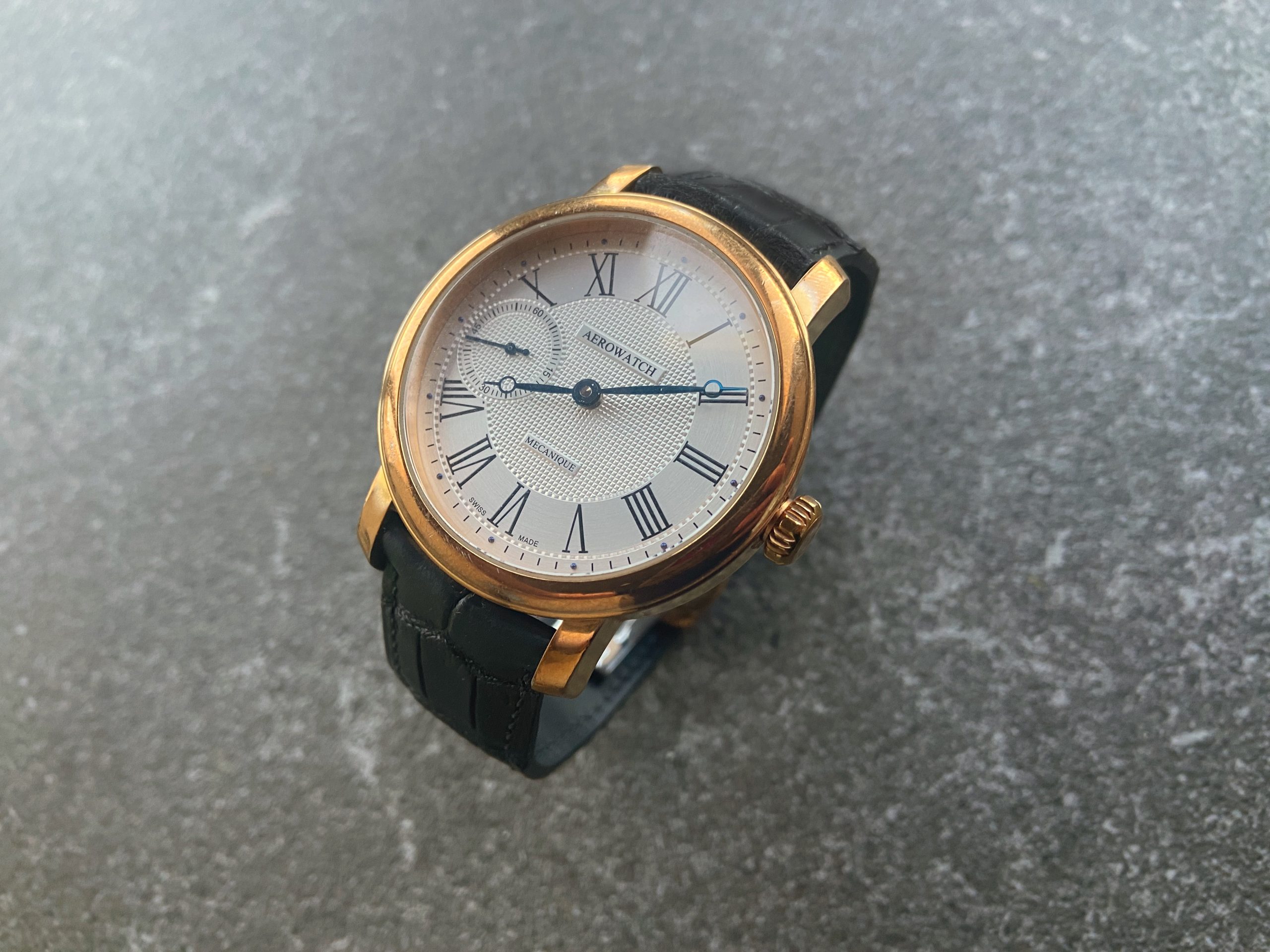 Gold Aerowatch timepiece with custom black alligator strap fitted