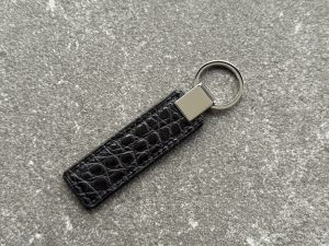 Black structured grain leather key fob with polished 316L stainless steel hardware