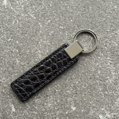 Black structured grain leather key fob with polished 316L stainless steel hardware