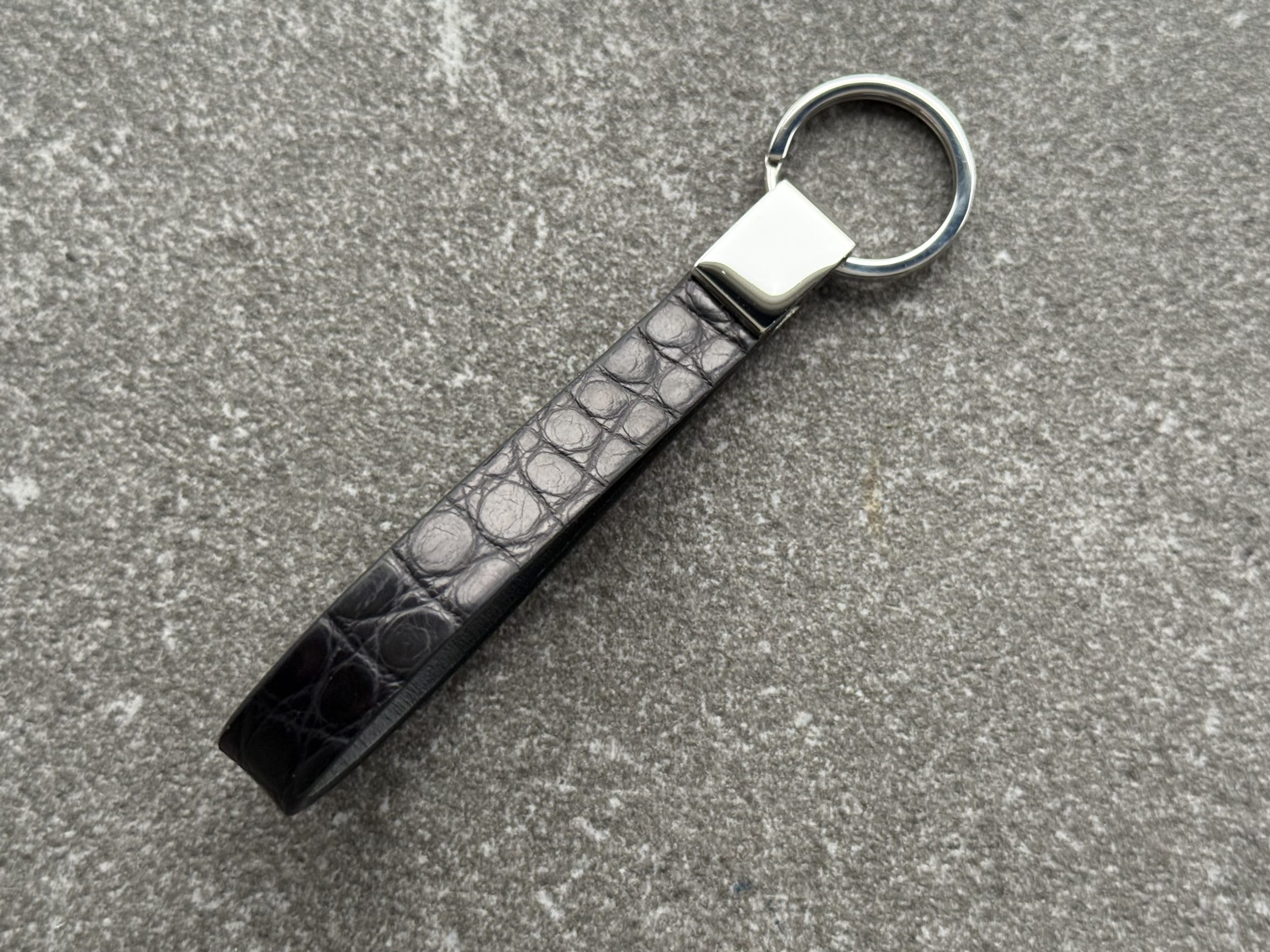 Black structured grain leather loop key holder with polished 316L stainless steel hardware