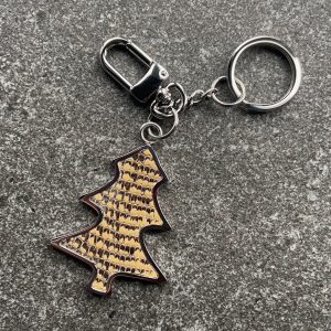 Tree-shaped key chain and bag charm with sand coloured scaled leather insert