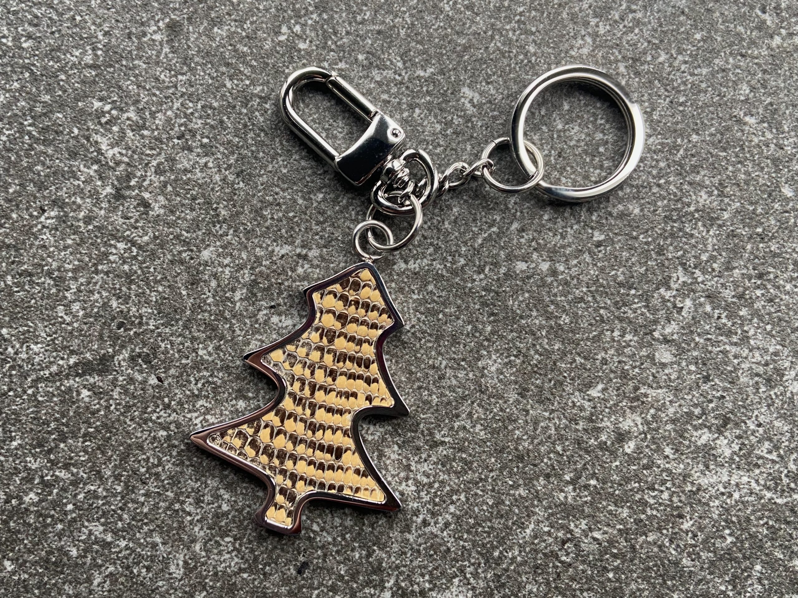 Tree-shaped key chain and bag charm with sand coloured scaled leather insert