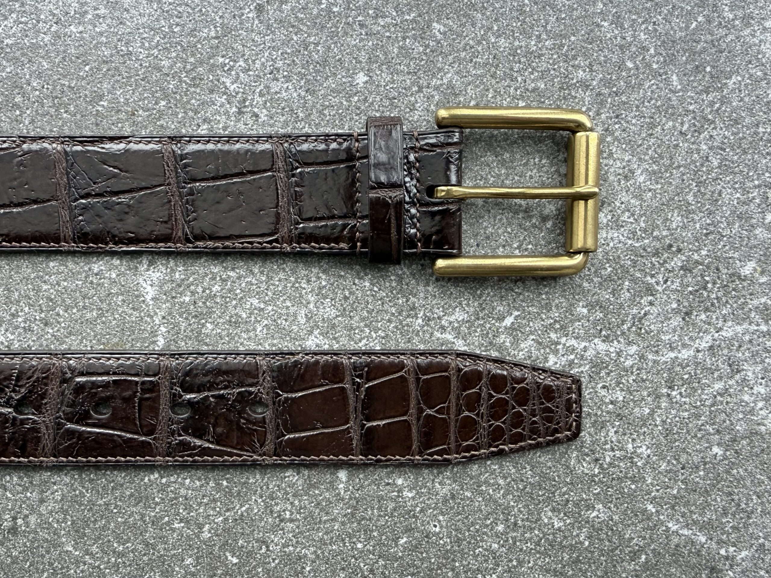 Alligator tail belt with solid brass sewn in buckle, natural scarring, and hand stitching